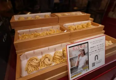 a display of ravioli in wooden boxes with a magazine at Casa Mirella near Piazza Navona, Rooftop Views in Rome