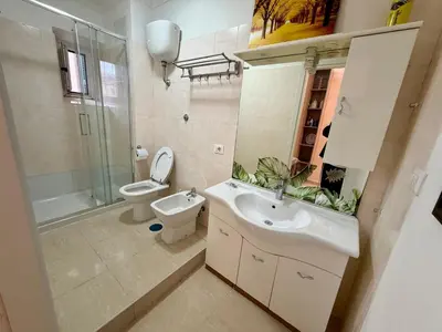 a bathroom with a sink and a toilet and a shower at Cosmo Terzo GuestHouse Roma in Rome