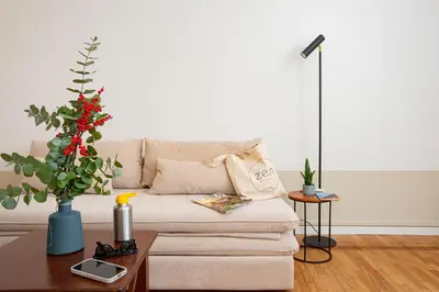 a living room with a couch and a table at Zen 31 - Colosseum cozy apartment in Rome