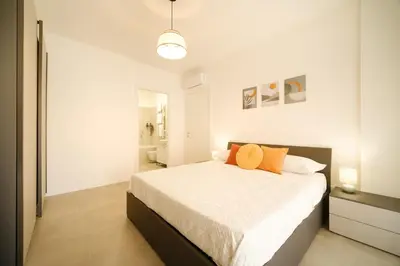 a bedroom with a bed and a bathroom at Bonelli 67 Apartment in Rome