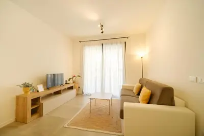 a living room with a couch and a television at Bonelli 67 Apartment in Rome