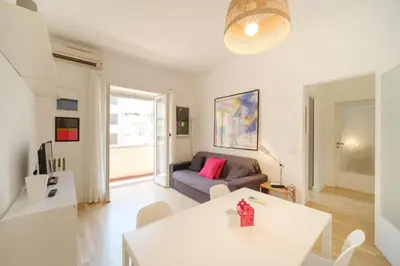 a living room with a couch and a table at Blue Apartment Testaccio & Trastevere in Rome