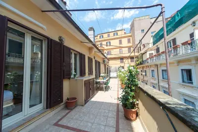 a balcony of a building with potted plants on it at My Monti Charming Holiday Home in Rome