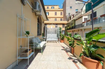 an apartment balcony with plants and a gate at My Monti Charming Holiday Home in Rome