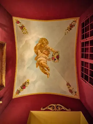 a bedroom with a bed and a table and a desk at Giordano Segreto in Rome