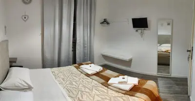 a bedroom with a bed with towels on it at vatican house tolemaide ottaviano in Rome