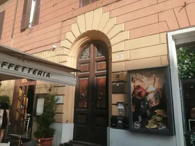 a store front with a wooden door in a building at Manrique home in Rome