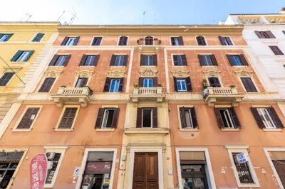 a large brick building with windows and balconies at Rome centre Vatican cozy apartment in Rome