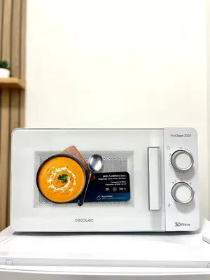 a microwave with an orange soup inside of it at Charming Well Connected New Studio - Asia Sleeps in Rome