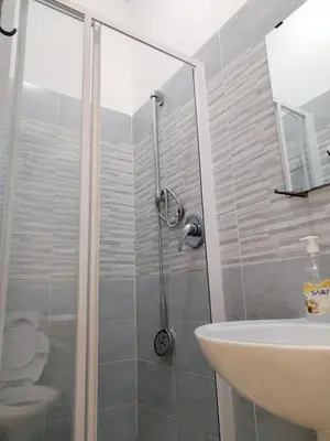 a bathroom with a shower and a sink at Next Stop Roma Affittacamere Casilino in Rome
