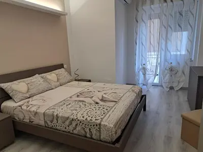 a bedroom with a bed and a window at A Casa di Giò in Rome