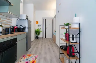 a kitchen with a refrigerator and a counter top at A Casa di Giò in Rome