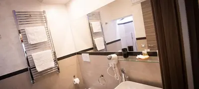 a bathroom with a shower and a sink and a mirror at Monteverde Charme -ROMA- in Rome