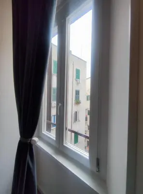 a window with a view of a building at Castle Suite Borgo in Rome