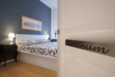 a bedroom with a bed with a sign on the door at Castle Suite Borgo in Rome