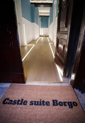 a door with a sign that reads castle sulfide baez at Castle Suite Borgo in Rome