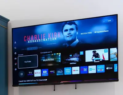 a flat screen tv with a movie on it at Castle Suite Borgo in Rome