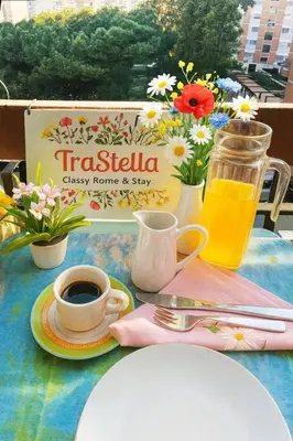 a table with a cup of coffee and a drink at TraStella, Trastevere di charme, balcone & hammam in Rome