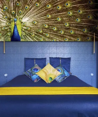 a bedroom with a bed with a ceiling with peacock feathers at TraStella, Trastevere di charme, balcone & hammam in Rome