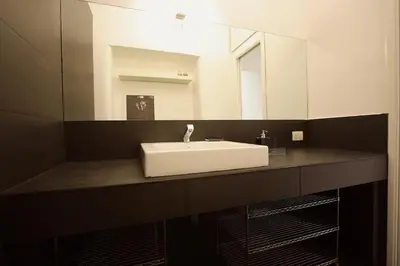 a bathroom with a white sink and a mirror at Art & Music Holiday Home in Rome