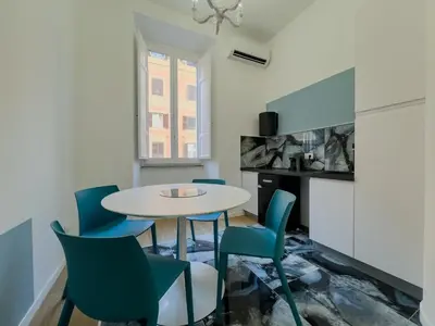 a living room with a couch and a table at Santamaura Vacanze Vaticane Elegance e Comfort in Rome