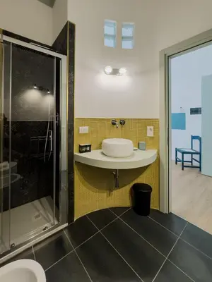a bathroom with a toilet and a shower at Santamaura Vacanze Vaticane Elegance e Comfort in Rome