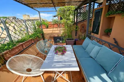 a bathroom with a sink and a toilet and a mirror at Panoramic Terrace Trastevere Apartment Amazing view in Rome