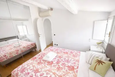 a living room with a couch and a television at Panoramic Terrace Trastevere Apartment Amazing view in Rome