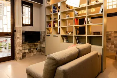 a living room with a couch and a fireplace at Andy Home in Rome