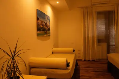 a living room with two chairs and a couch at Domus Piscariae in Rome