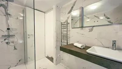 a bathroom with a sink and a shower at Domus Jana 30 in Rome