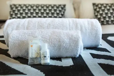 a pile of towels and products sitting on a floor at Albani Retreat in Rome