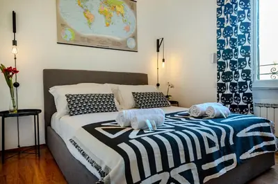 a bedroom with a bed with two towels on it at Albani Retreat in Rome