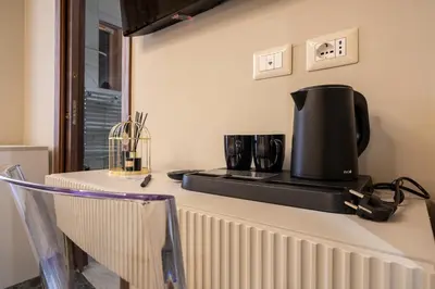 a coffee maker on a counter in a kitchen at Roma suite hotel in Rome