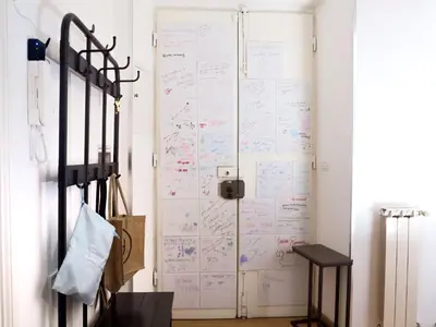 a room with a door with writing on it at Casa Bellezza a Cola di Rienzo in Centro in Rome