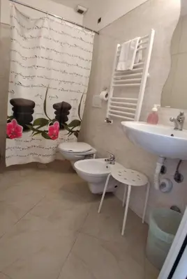 a bathroom with a toilet and a sink at Cressy in Rome