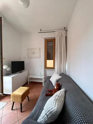 a child laying on a bed in a bedroom at San Vito Cozy Apartment in Rome