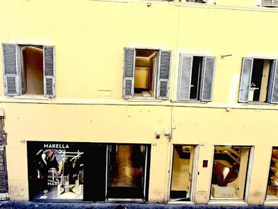 a building with broken windows and a store at DUNE at Spanish Steps Luxury Apartment-Suite in Rome