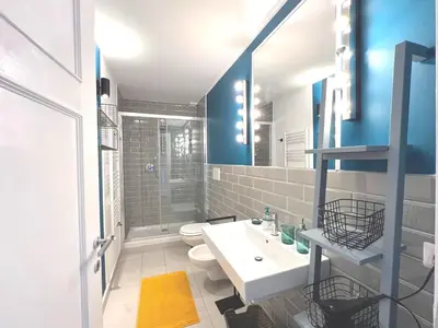 a bathroom with a sink and a toilet and a mirror at Casa Polveriera at Colosseum in Rome