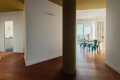 a dining room and kitchen with a table and chairs at Fifi's Flaminio Panoramic Apartment 120mq in Rome