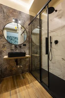 a bathroom with a shower and a mirror at Aida Luxury Apartment in San Giovanni in Rome