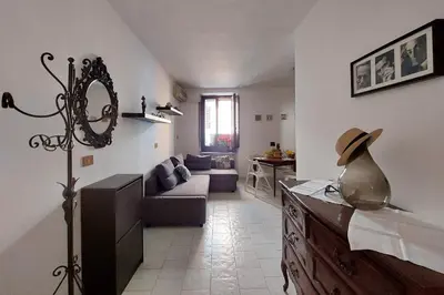 a living room with a couch and a table at Eat Pray Stay Pantheon in Rome