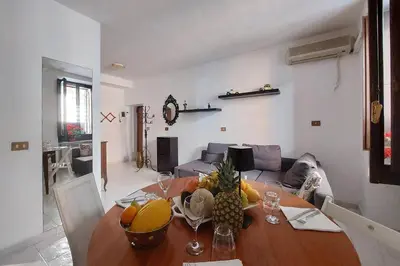a living room with a table with fruit on it at Eat Pray Stay Pantheon in Rome