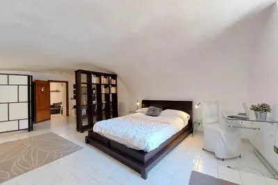 a bedroom with a bed and a desk at Eat Pray Stay Pantheon in Rome