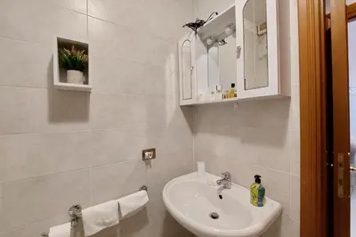 a bathroom with a sink and a mirror at Eat Pray Stay Pantheon in Rome