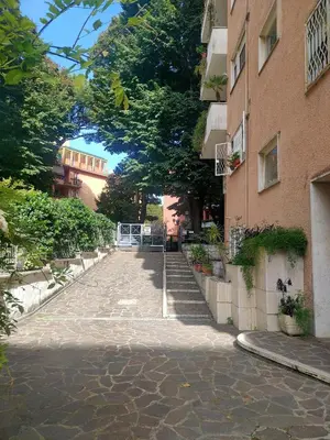 a cobblestone street in front of a building at CasaCoco con posto auto e 2 bagni in Rome
