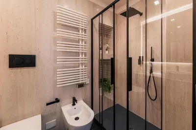 a bathroom with a shower and a toilet and a sink at Exclusive Domus Gaudia in Rome