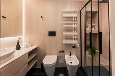 a bathroom with a toilet and a sink at Exclusive Domus Gaudia in Rome