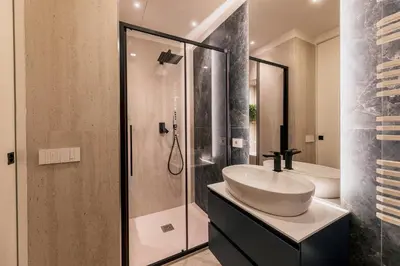 a bathroom with a sink and a shower at Exclusive Domus Gaudia in Rome