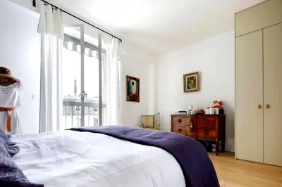 a bedroom with a bed and a window and a dresser at Appartamento Marissia in Rome